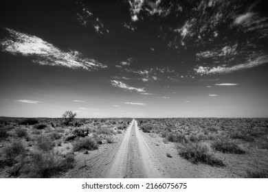 A gravel road in the Texas desert near Horizon City, Texas just east of El Paso. - Shutterstock ID 2166075675