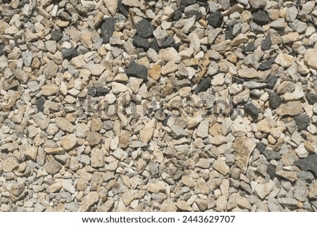 Gravel a lot of rocks rock stone light natural grey color on outdoor garden floor