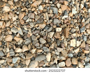 Gravel small. Small marine gravels in the background.Pebbles, stones, wet, texture, background. Sea pebbles and stones, wet, texture, background.A close up view of smooth polished multicolored stones. - Powered by Shutterstock