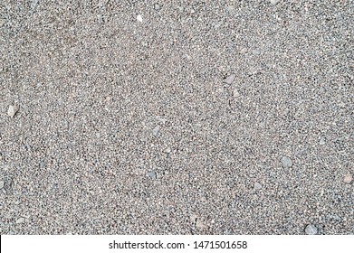 Gravel texture. Fine light gray stone gravel. Natural textural background.