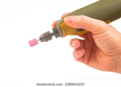 graver and drilling electric tool on a white background. dremel for processing materials and repairing parts - Powered by Shutterstock