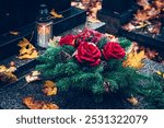 graves decorated with lanterns, burning candles, colorful chrysanthemum flowers, catholic symbols