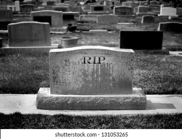 Gravestone In Cemetery With Words RIP Rest In Peace Carved