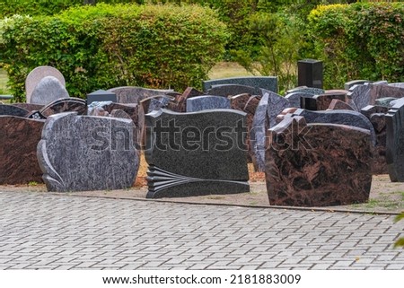 Gravestones of different shape and color as a souvenir for the grave of the survivors