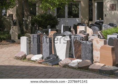 Gravestones at a stonemason issued for sale to the survivors