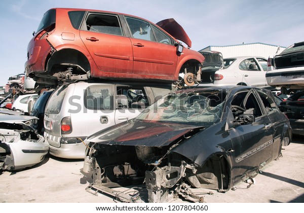 A\
graveyard of cars, broken cars sell on spare\
parts.