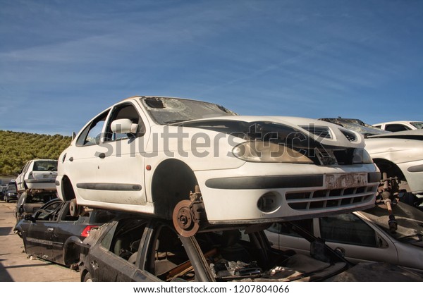 A\
graveyard of cars, broken cars sell on spare\
parts.