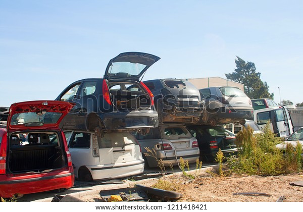 A\
graveyard of cars, broken cars sell on spare\
parts.	\
