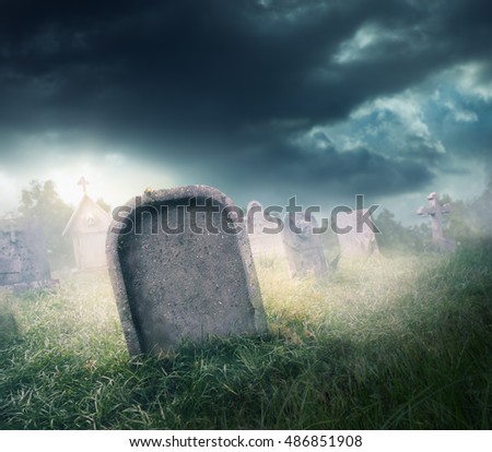 graveyard with fog with dramatic lighting