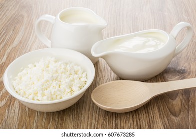 Gravy Boat With Sour Cream, Jug Milk, Cottage Cheese And Spoon On Wooden Table