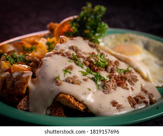 Gravy Smothered, Mouth Watering Chicken Fried Steak And Eggs.