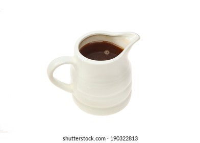 Gravy In A White China Jug Isolated Against White