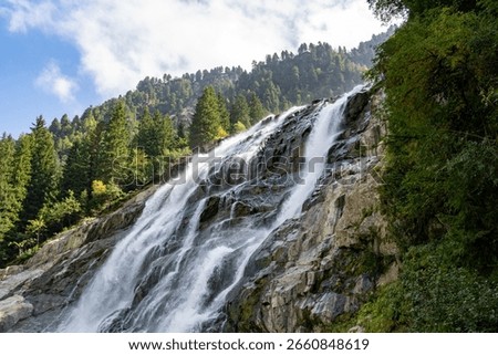 Grawa Waterfall Cascading Down a Steep Rocky Cliff Face in Austria