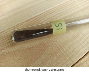 Gray Amorphous Silicon Powder In A Test Tube.