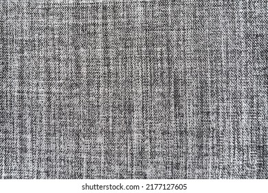 gray background fabric texture. A piece of woolen cloth is neatly laid out on the surface. Weave and textile texture. Dress fabric or for kitchen needs, tablecloth or curtains, close-up. Dash.