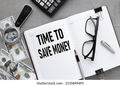 gray background with open notepad with text. TIME TO SAVE MONEY