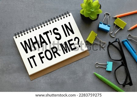 gray background open notepad with text. WHATS IN IT FOR ME