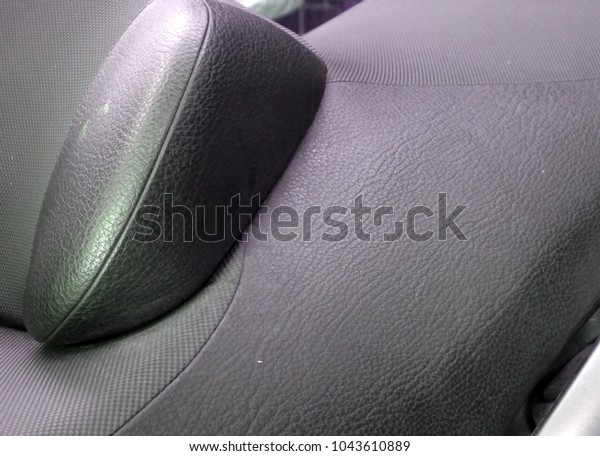 Gray background\
repaired car seat upholstery\
