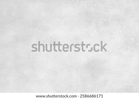 A gray background with a subtle textured style. The gray background is smooth with a soft, muted appearance. Gray concrete textured background with copy space.