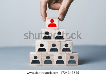 Gray background with wooden blocks of people silhouettes