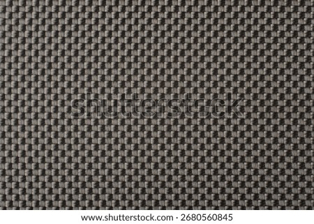 gray basket-weave pattern on woven material surface, monochromatic color full-frame background, simplicity, elegance and textile art concept, close-up macro view