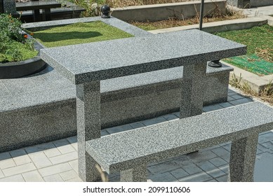 Gray Bench And Table Of Stone And Marble At The Grave In The Cemetery