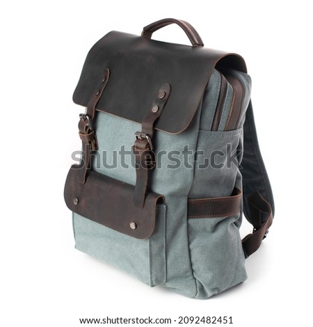 Gray and black canvas backpack isolated on white background