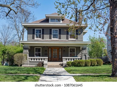 Gray Brick Craftsman Style House With Open Porch