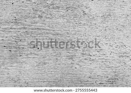 Gray brushed concrete texture with horizontal ridges. Abstract weathered cement background, gritty stone surface for industrial design, architectural overlays, and minimalist backdrop.