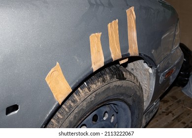 Gray Car Fender Covered With Duct Tape Close Up