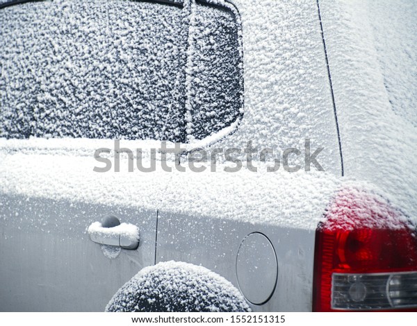 \
gray car\
with windows covered with snow        \

