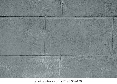 Gray cement block wall with rough texture for industrial architecture and construction concept