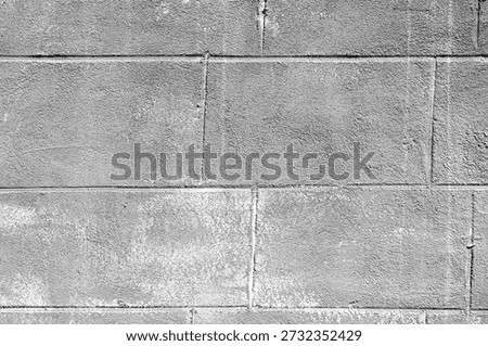 Gray cement block wall with rough texture for industrial architecture and construction concept