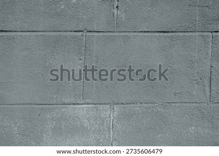 Gray cement block wall with rough texture for industrial architecture and construction concept