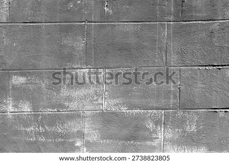 Gray cement block wall with rough texture for industrial architecture and construction concept