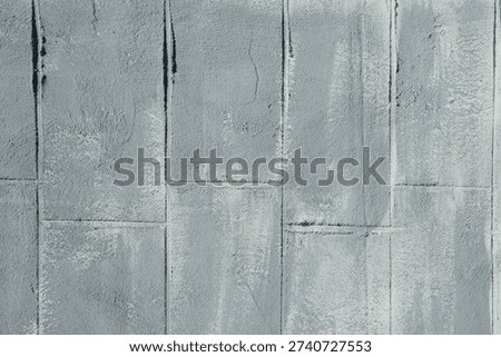 Gray cement block wall with rough texture for industrial architecture and construction concept