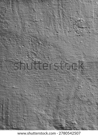 Gray cement wall texture featuring a gritty, uneven surface with horizontal grit lines and natural imperfections. Perfect for architectural visualization or grunge-style graphic design Rough gray concrete plaster surface texture background in black and white.
