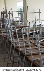 The Gray Chairs And Desks In The School Building Are Kept Organized For The Semester Break.