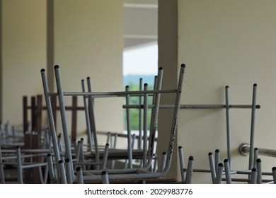 The Gray Chairs And Desks In The School Building Are Kept Organized For The Semester Break.