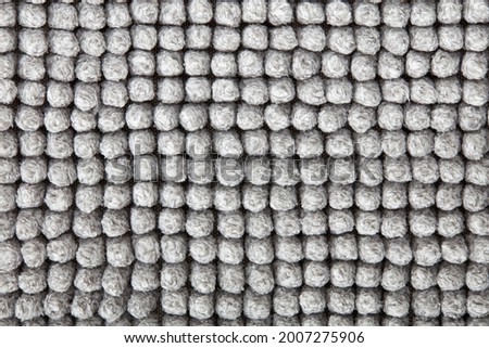 Gray chenille bath mat texture background
