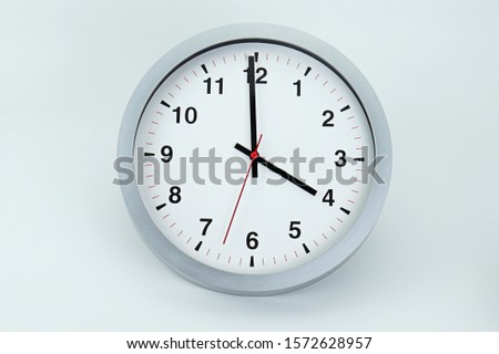 Gray clock beginning of time 04.00 am or pm, on white background, Copy space for your text, Time concept. 