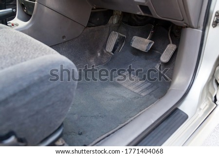 Similar – Image, Stock Photo Three rubber floor car mats lying on the street ground. Car interior cleaning concept