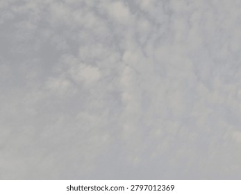 Gray clouds covering the sky before rainfall, with hazy air and low visibility from particulate pollution, creating a gloomy weather atmosphere.