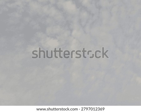 Gray clouds covering the sky before rainfall, with hazy air and low visibility from particulate pollution, creating a gloomy weather atmosphere.