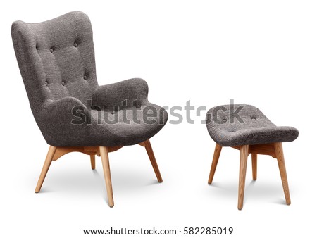 Gray color armchair and small chair for legs. Modern designer armchair on white background. Textile armchair and chair. Series of furniture.