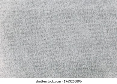 Gray colour velour textile sample. Fabric texture background