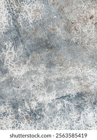 gray concrete surface texture with fine cracks and dirt stains, giving an old and weathered impression.