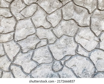 A gray concrete wall with a chaotic decorative pattern. Background, surface