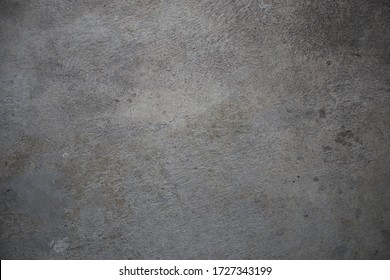 Gray concrete wall consisting of cement, stone and sand
