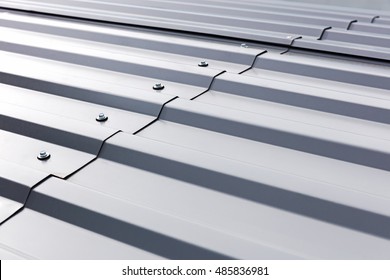 gray corrugated metal cladding on industrial building roof